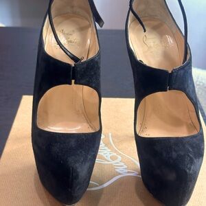 Black suede high Mary Jane Christian Louboutin shoes gently work